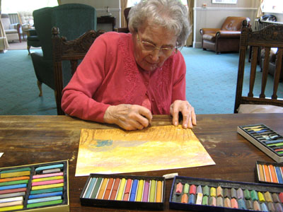 This is Jessie. She is 100yrs old and is working on her first ever pastel drawings! :-)